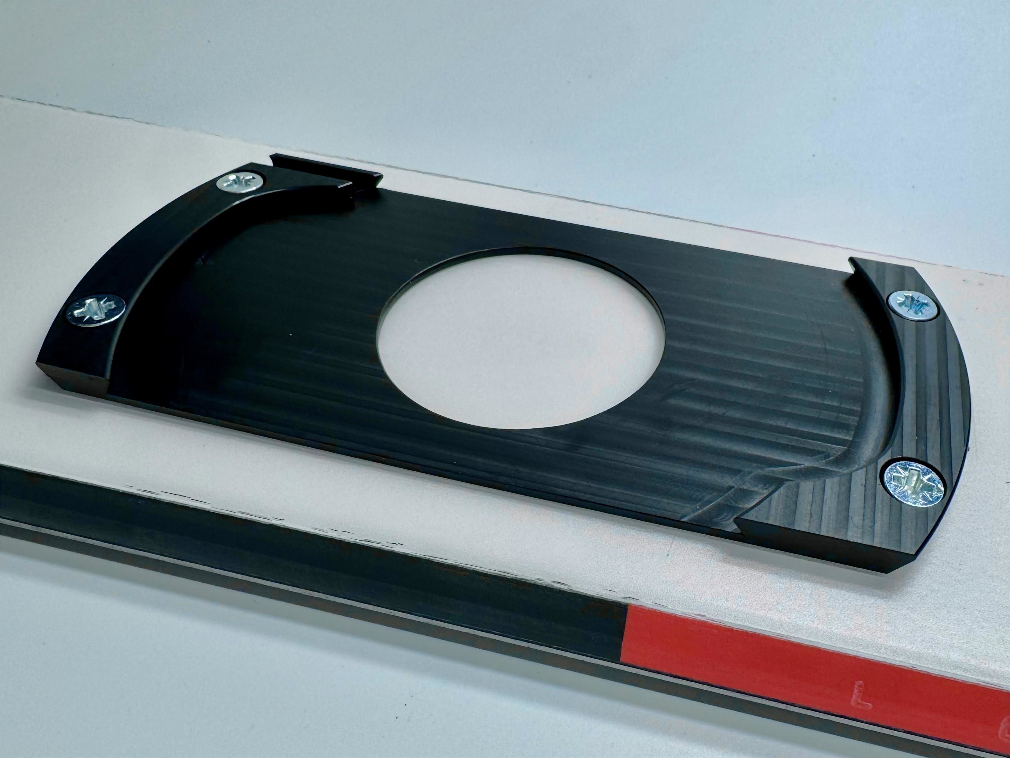 Base plate mounted to a ski